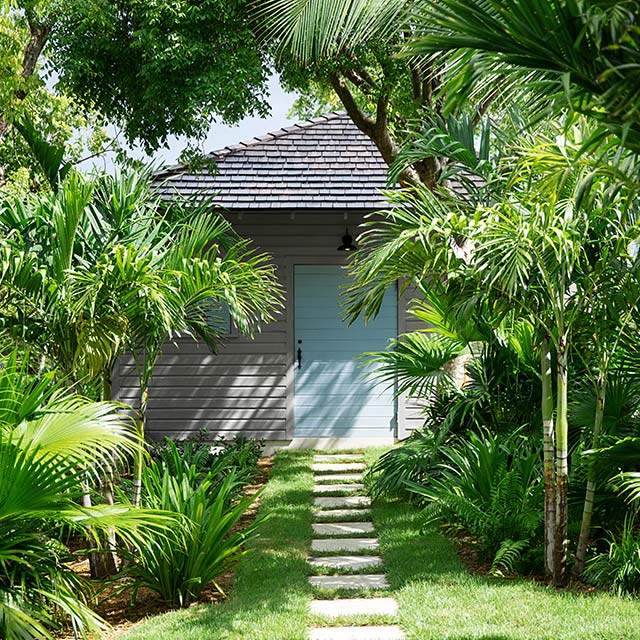 gray home blue door tropical