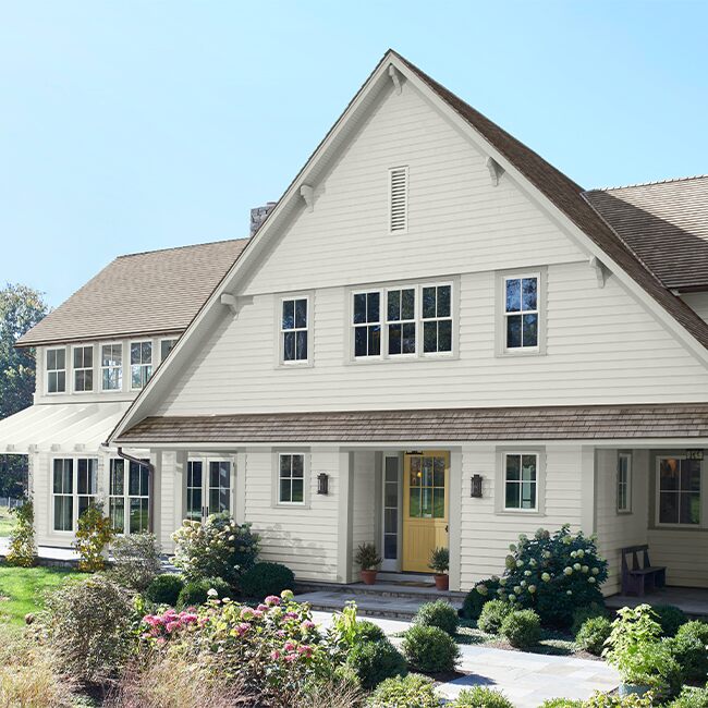 white-painted-house-yellow-door-650x650